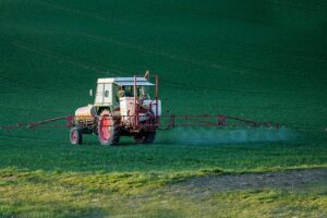Tractor spraying herbicide