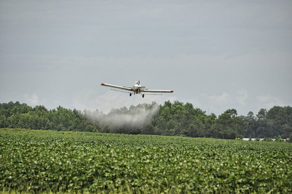 Plane spraying herbicide